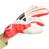 A red and white Adidas goalkeeper glove with black stripes and protective padding, shown against a black background.