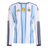 Long-sleeved Argentina home jersey with light blue and white vertical stripes, the gold FIFA World Champions 2022 patch, and the AFA crest with three gold stars.