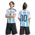 Front and back view of a child wearing an Argentina soccer jersey with "Messi 10" and dark shorts against a solid black background.