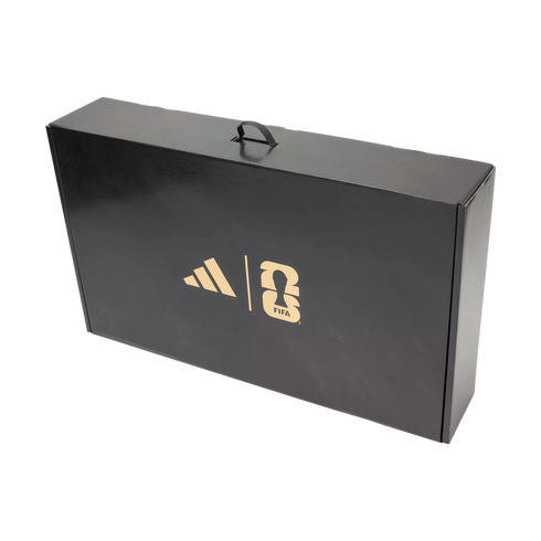A black textured briefcase-style box featuring a gold Adidas logo and the FIFA World Cup 2026 logo on its front side.