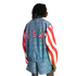 Back view of a person wearing a denim-print jacket with "USA" on the back, red and white striped sleeves, and matching shorts.