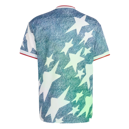 Back view of a blue, denim-textured t-shirt featuring scattered large white stars and red and white trim on the collar and sleeves.