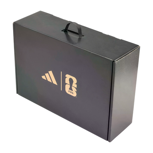 A black rectangular box with a carry handle, featuring gold Adidas and FIFA World Cup 2026 logos on the front panel.