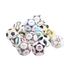 A pile of various Adidas FIFA World Cup official match balls from different years, arranged against a solid black background.