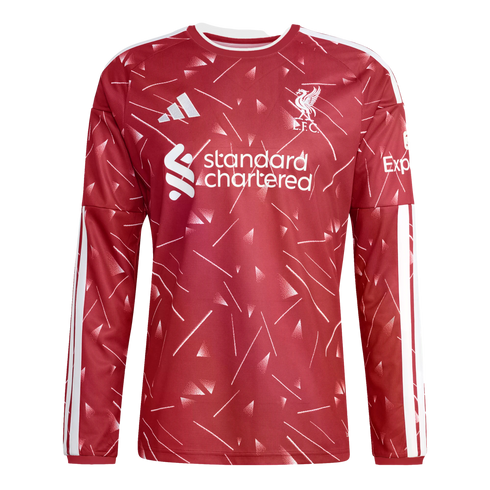 A red long-sleeve Liverpool FC training top with white geometric patterns, Adidas logo, club crest, and Standard Chartered sponsor logo.