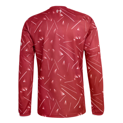 Back view of a red long-sleeved jersey with a white abstract pattern of lines and triangles. A "97" memorial emblem is printed at the top center.
