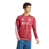 A young man wearing a red long-sleeved Liverpool FC jersey with white patterns and logos, paired with blue jeans, set against a white background.