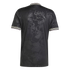 Back view of a black short-sleeved jersey with a tonal grapevine and leaf pattern. White and maroon stripes accent the collar and sleeve cuffs.