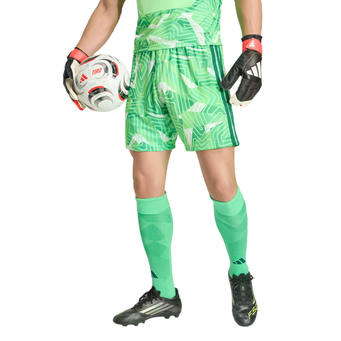 Goalkeeper in a green patterned soccer kit and gloves holding a soccer ball.