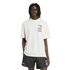 A Black man with locs wearing a white Adidas WorldCup USA 94 graphic T-shirt and matching black shorts against a white background.