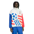 A man with dreadlocks wearing a white Adidas tracksuit jacket with red and blue graphics commemorating World Cup USA '94. The jacket features a large blue soccer ball design, red stripes, and mismatched red and blue sleeves. He is wearing coordinating blu