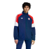 Man in a navy blue, red, and white Adidas Bayern Munich tracksuit featuring the club crest and trefoil logo, against a black background.