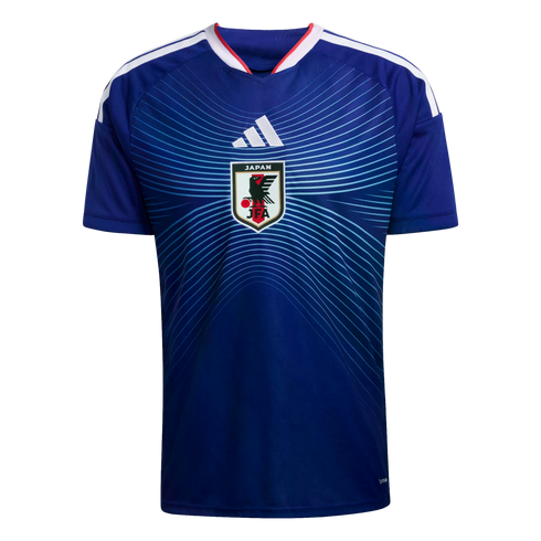 Blue Japan national team soccer jersey with a centered white Adidas logo and JFA crest, featuring a light blue radiating line pattern and white stripes on the shoulders.