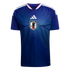 Blue Japan national team soccer jersey with a centered white Adidas logo and JFA crest, featuring a light blue radiating line pattern and white stripes on the shoulders.