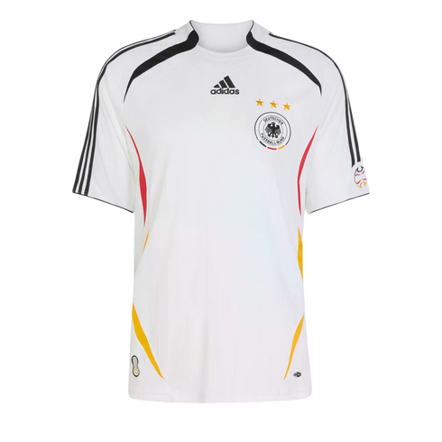 A white Adidas Germany national football team home jersey featuring the team crest with three gold stars and black, red, and yellow side accents.