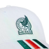 Close-up of a white cap featuring the embroidered Mexico national football team logo and green and red stripes on the brim, set against a black background.