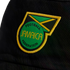 An embroidered Jamaica Football Federation crest on black fabric. The patch features a green circle with the team name and Jamaican flag elements, framed by yellow stitching.