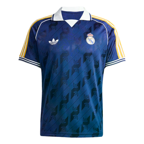 A navy blue Real Madrid football jersey with a white polo collar, yellow shoulder stripes, and a tonal diagonal pattern featuring the Adidas trefoil logo.
