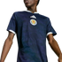 Person wearing a dark blue Adidas Scotland national football team jersey with white trim and a faint diamond pattern, set against a black background.