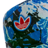 Close-up of an Adidas cap featuring an abstract blue and white splatter pattern and an embroidered red and white Trefoil logo.