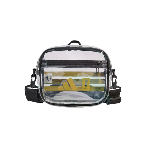 Transparent Adidas crossbody bag with black trim and strap, featuring a yellow logo and striped pattern on the front.