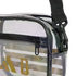 Close-up of a clear Adidas shoulder bag with black trim, a gold logo, and a black zipper. A black adjustable strap is attached with a plastic swivel hook.