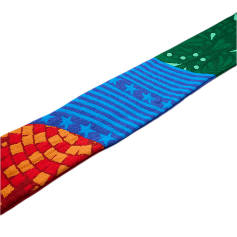 A colorful patterned fabric strip featuring a red and orange mosaic, blue stars and stripes, and a green floral design, set against a white background.