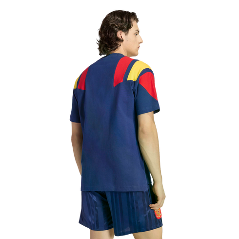 Back view of a person wearing a blue soccer kit with red and yellow shoulder details against a white background.