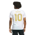 Rear view of a man in a white T-shirt featuring gold "MESSI 10" lettering on the back. He has dark curly hair and wears black athletic shorts against a black background.