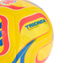 A close-up of a yellow Trionda Club replica soccer ball featuring red and blue patterns and a Colombian Football Federation logo.