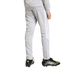 Rear view of a person wearing light gray track pants with white side stripes and black soccer cleats with neon green accents.
