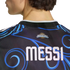 Back view of a dark soccer jersey with blue swirls, featuring the name "MESSI" in large white letters below an Argentina logo with a gold sun.