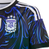 Close-up of an Argentina soccer jersey featuring a black and blue swirling pattern, white shoulder stripes, and the AFA crest with three stars.