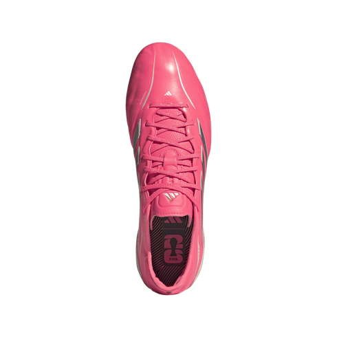 Top-down view of a bright pink Adidas soccer cleat with pink laces and silver accents, isolated on a white background.
