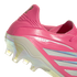 Close-up of the heel of a pink soccer cleat featuring silver "COPA" branding, silver stripes, and an iridescent translucent soleplate with studs.
