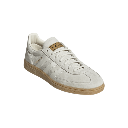 Adidas Samba Messi sneaker featuring an off-white suede upper, white leather stripes, a gum rubber sole, and gold Messi branding on the side and tongue.