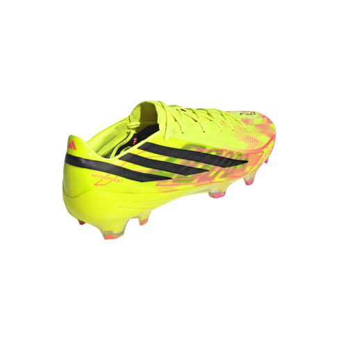A bright yellow Adidas F50 soccer cleat with black stripes and pink accents, shown from a rear-side angle against a solid black background.