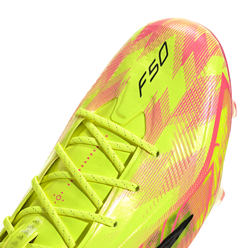 Close-up of a neon yellow and pink soccer cleat with black "F50" branding and matching yellow laces.