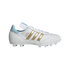 Side view of a white Adidas Copa Mundial soccer cleat with gold stripes and light blue accents on the heel and tongue, against a black background.