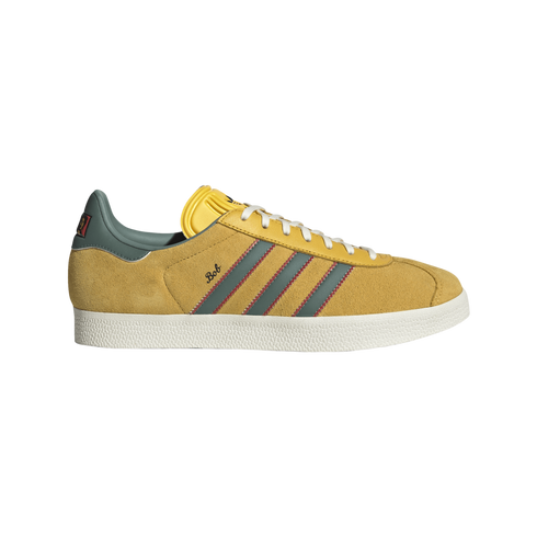 Side view of a yellow suede sneaker with grey stripes, red zig-zag stitching, white soles, and "Bob" written in script on the side.