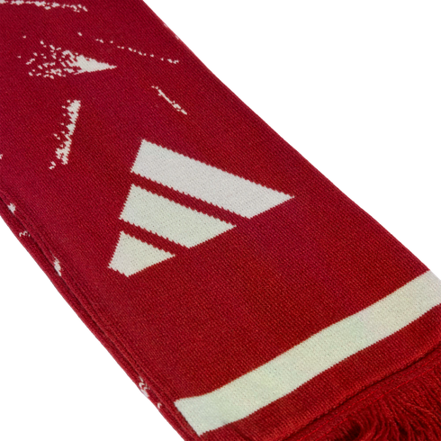 A red knitted scarf featuring a white Adidas logo, a white horizontal stripe, and red fringe at the end.