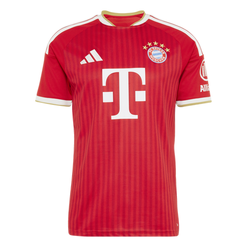 A red soccer jersey with vertical stripes, featuring the FC Bayern Munich crest, white Adidas logo, and white "T" sponsor logo. White and gold trim accents the collar and sleeve cuffs.