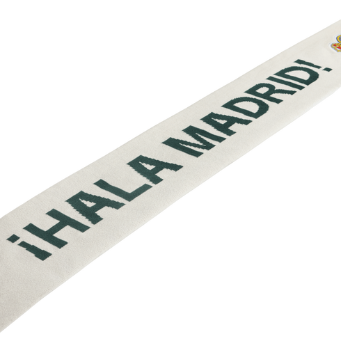 White scarf with dark green "¡HALA MADRID!" text and a small Real Madrid crest.