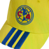Close-up of a yellow baseball cap with the Club América logo embroidered on the front and three blue stripes on the brim.