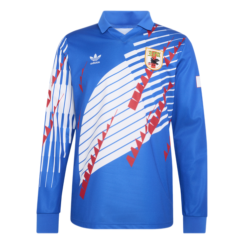 A blue long-sleeved Adidas jersey with a white and red geometric design, featuring a collared neck, Adidas trefoil logo, and a team crest on the chest.