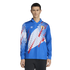 A male model wearing a long-sleeved blue Adidas soccer jersey with white stripes, red graphic accents, and a team crest.