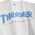White t-shirt featuring light blue Adidas logo, large arched 'THRASHER' text, and 'REVISTA' in stylized blue script underneath.