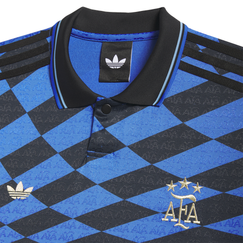 Close-up of a blue and black diamond-patterned Adidas Argentina jersey with a black polo collar and gold embroidered AFA and Trefoil logos.