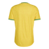 Back view of a yellow soccer jersey with green trim on the collar and sleeves, featuring a subtle, repeating tonal zig-zag pattern.
