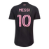 The back of a black soccer jersey with the name "MESSI" and the number "10" printed in a large, stylized pink font. Small pink text at the top reads "FREEDOM TO DREAM."
